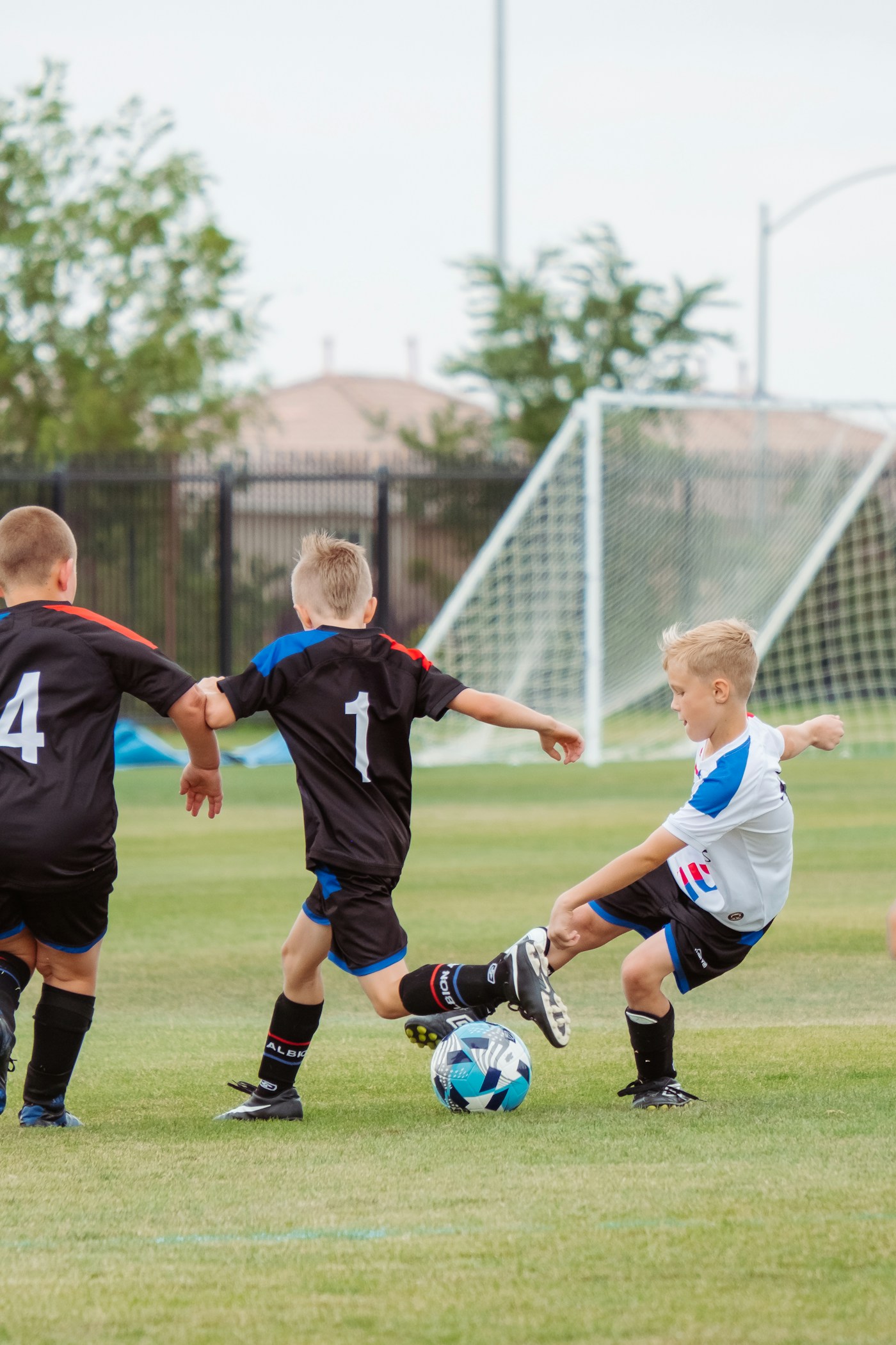 Young soccer players practicing movement and ball control